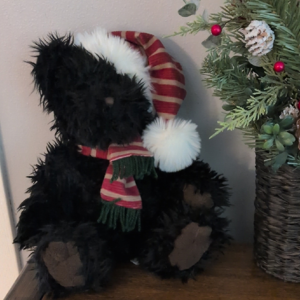 Festive Black Teddy Bear with Striped Hat and Scarf